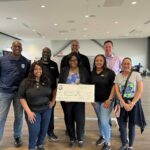 DR. E’LOIS THOMAS AND HER TEAM PRESENTING A CHECK AT THE ANNUAL PAL RADIOTHON, BACK ROW – FRED HUNTER, PAL ACTING CEO.., LEON RIGGS, SEEL, CALL CENTER MANAGER, DAVID GREENWOOD, PAL DIRECTOR OF PROGRAM & OPERATIONS, ALAN HUDDY, PAL BOARD CHAIR